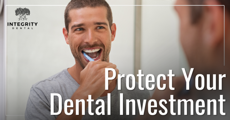 man brushing teeth in the mirror