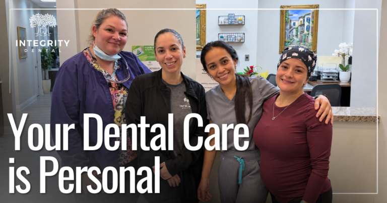 four woman coworkers smiling together