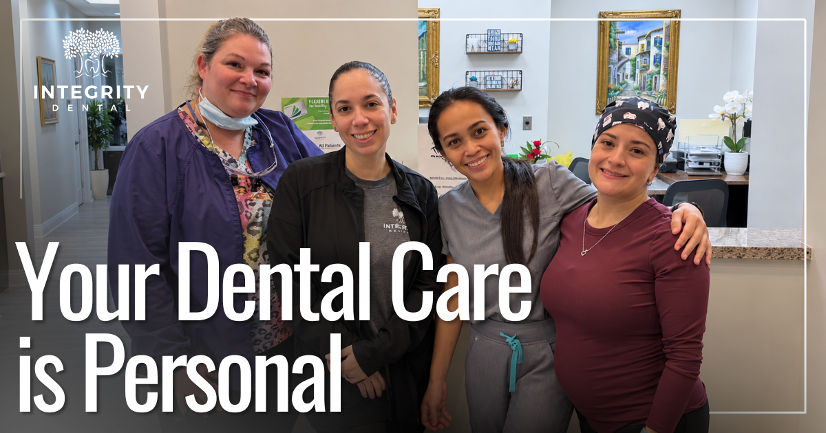 four woman coworkers smiling together